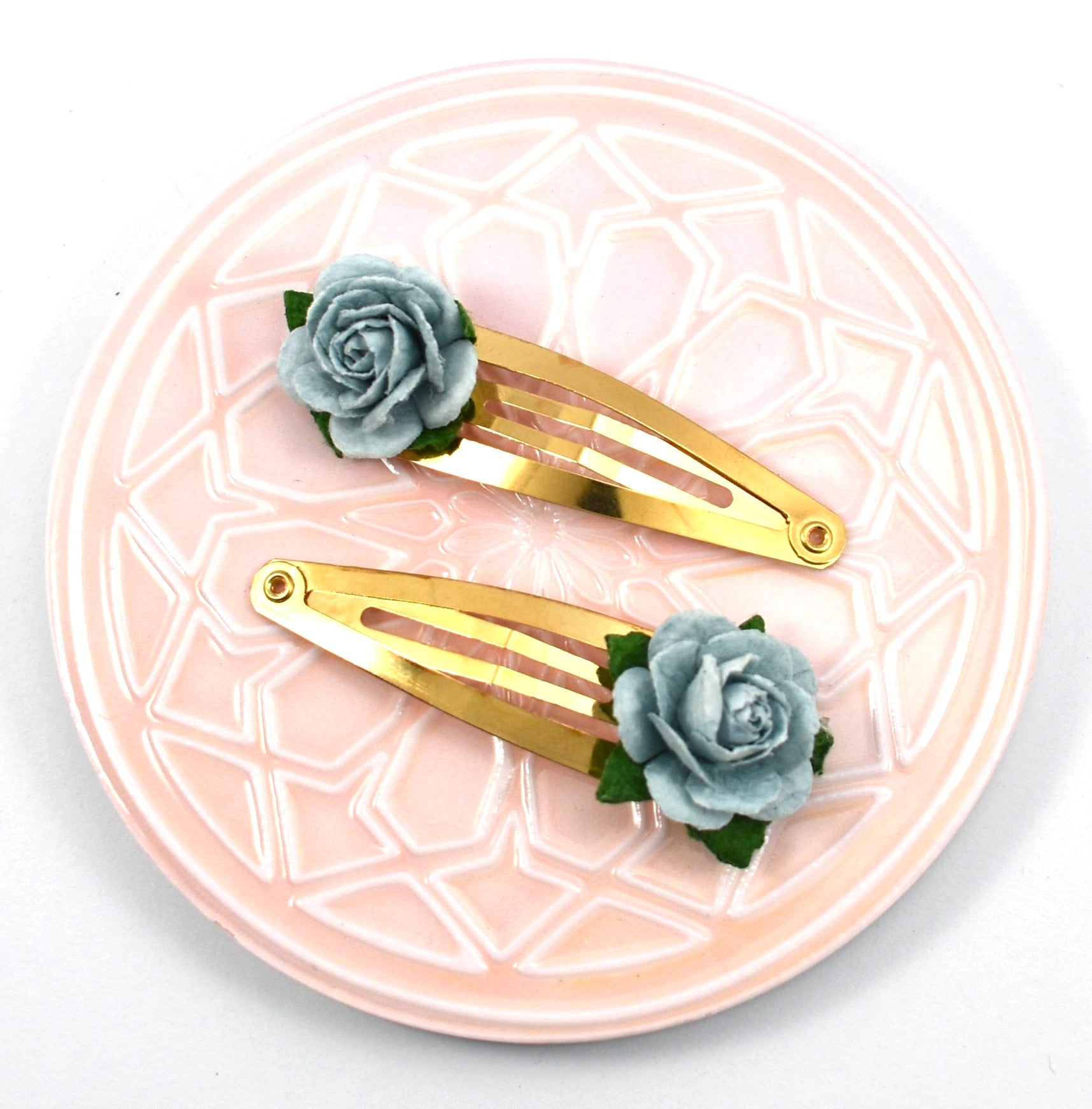 Rose gold snap clps with blue flowers